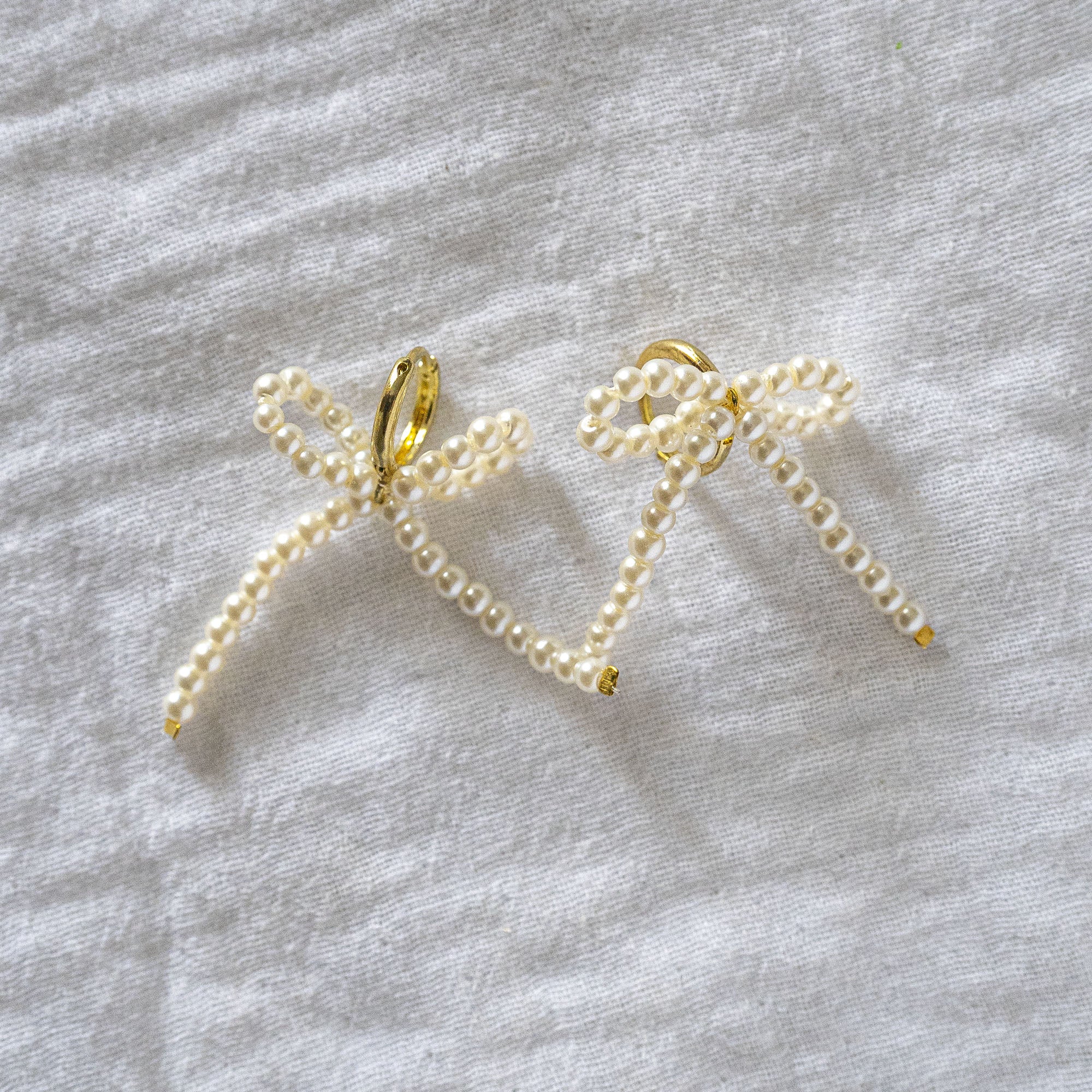 Delicate Pearl Beaded Bow Stud