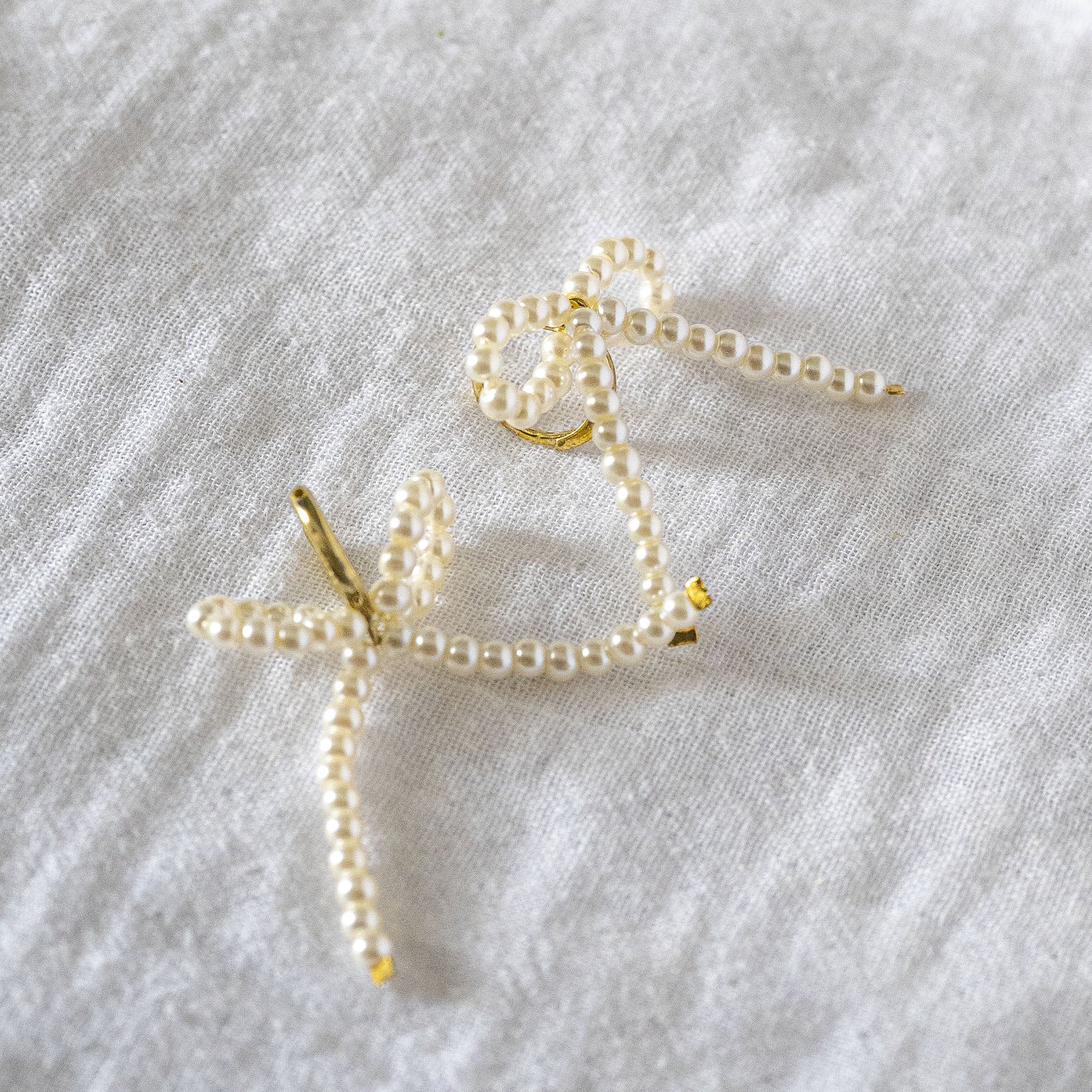 Delicate Pearl Beaded Bow Stud
