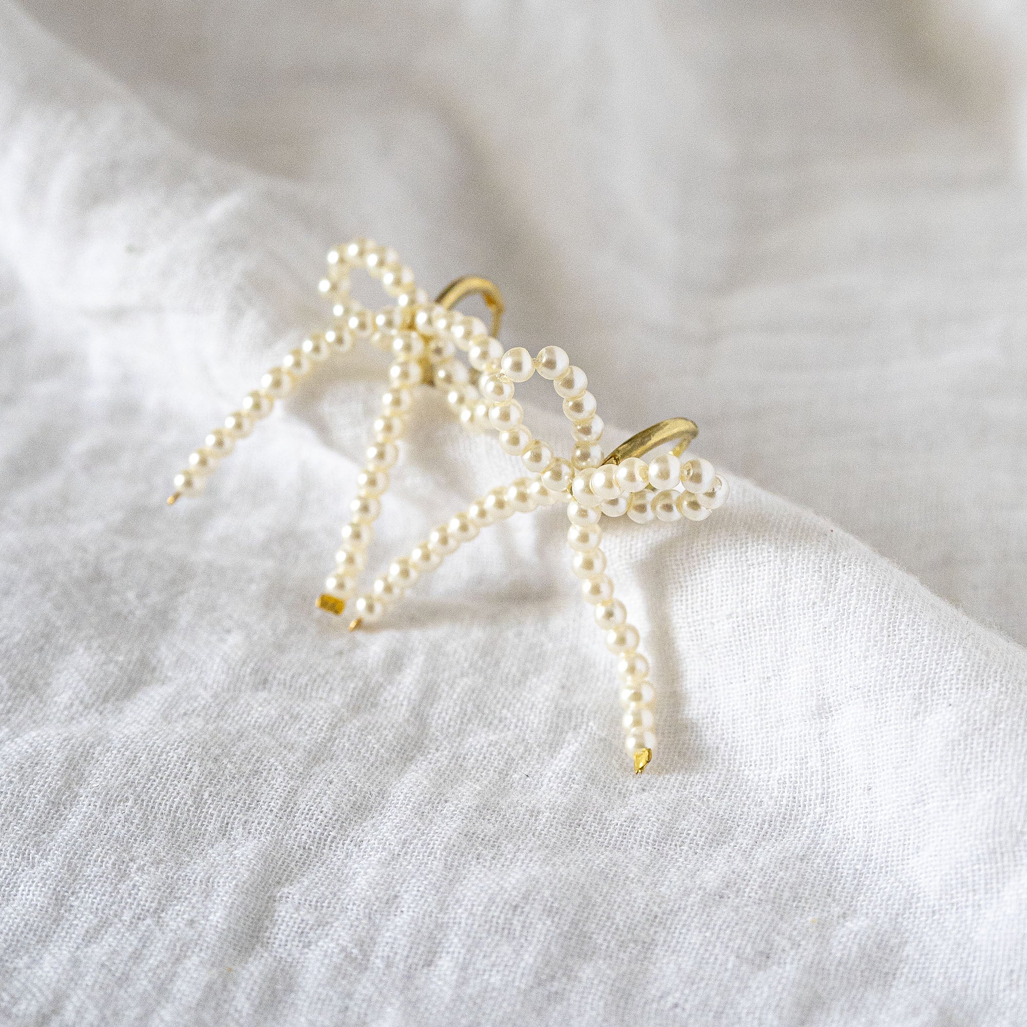 Delicate Pearl Beaded Bow Stud
