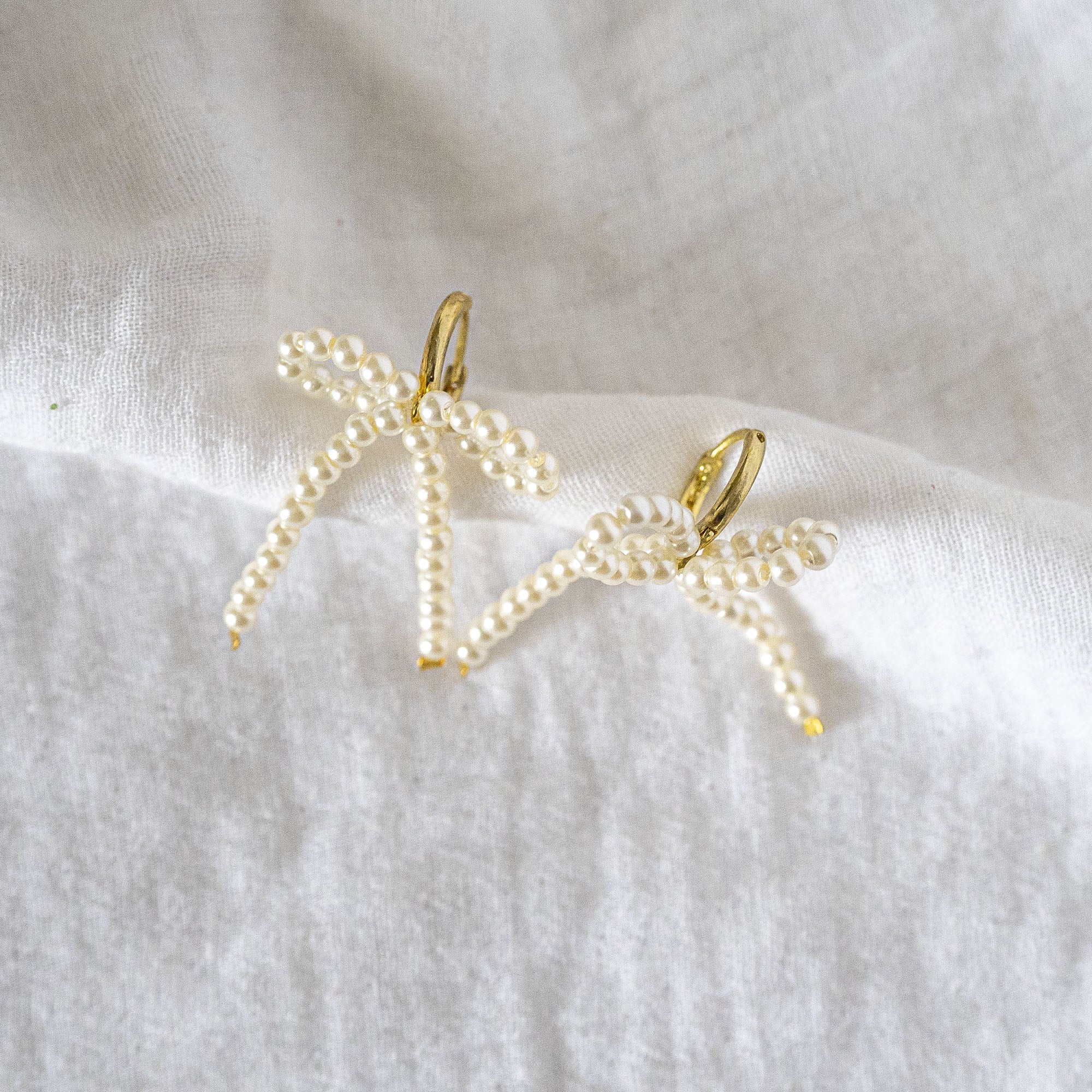 Delicate Pearl Beaded Bow Stud